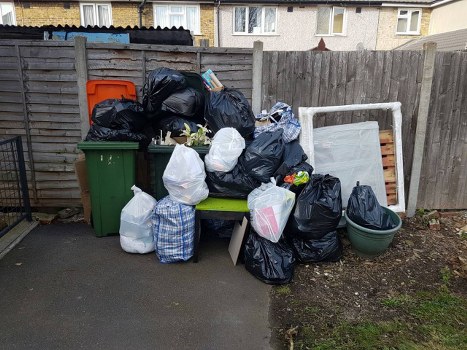 Collection crew sorting items for reuse during a Chiswick house clearance